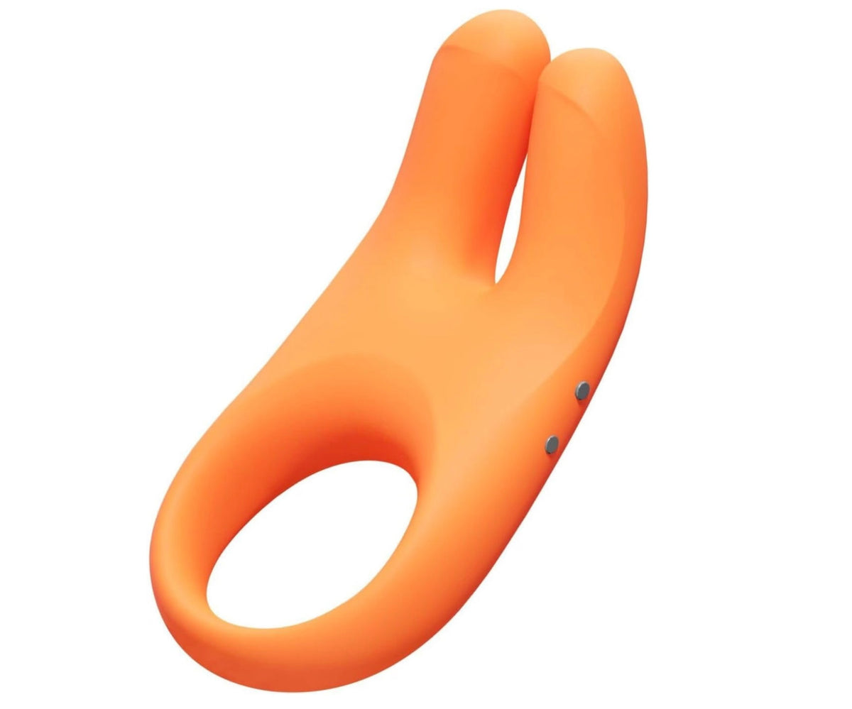 An orange silicone dual-stimulation cock ring vibrator with a smooth matte finish, shown on a solid white background.